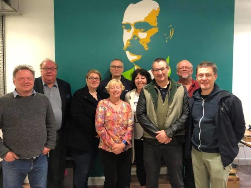 Some of the LI members attending the Dublin meeting in the Connect Union HQ, in front of a picture of James Connolly